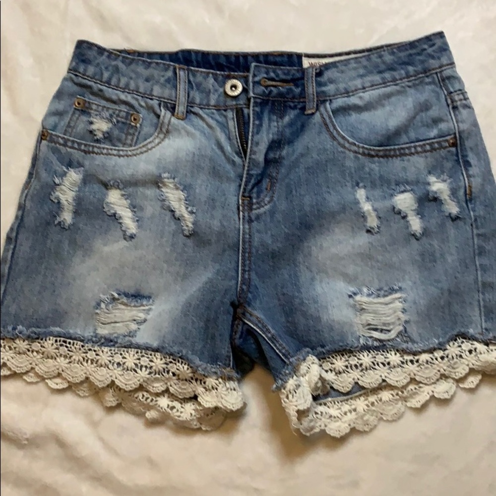 Distressed lace jeans